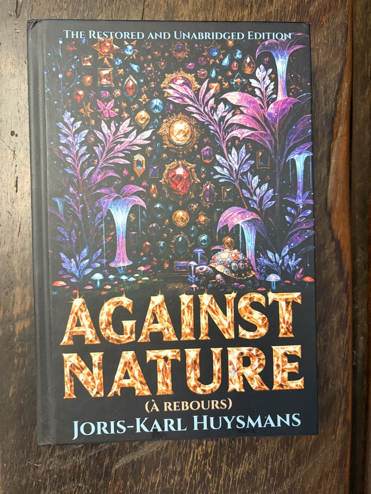 Photograph of a physical Time Warp Edition of Against Nature on a wooden table